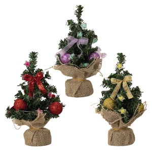 Three mini desktop Christmas trees with colorful ornaments and burlap bases for decor