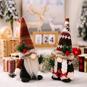 Pair of festive Christmas gnomes with knitted hats and pine needles ornaments