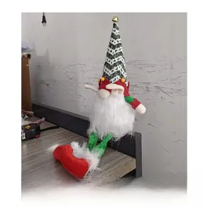 Side view of a Christmas gnome doll with a patterned hat, bell, and red sequin shoes
