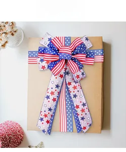 Close-up of American flag bow with stars and stripes on a rustic kraft gift box