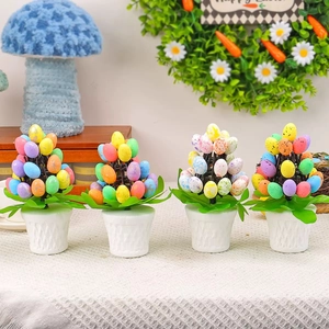 Set of four Easter egg potted plants with speckled eggs and white textured pots