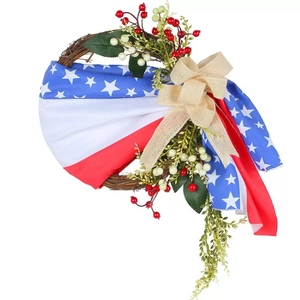 Patriotic July 4th door wreath with stars and stripes fabric, berries, and burlap bow