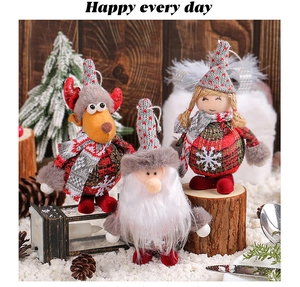 Detailed Christmas plush figurines including Santa and Reindeer on a cozy holiday setting