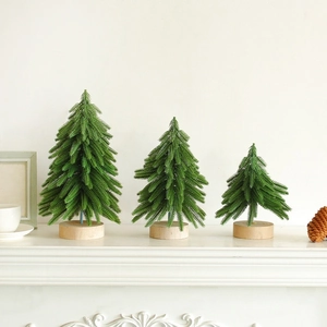 Three-piece mini artificial Christmas tree set with natural wooden bases for holiday decor