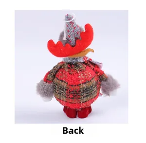 Back view of a Christmas reindeer plush ornament with red and green plaid fabric details