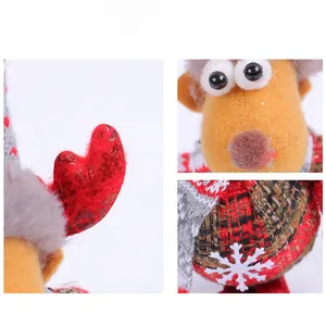 Close-up details of Christmas reindeer plush featuring festive plaid fabric and felt antlers