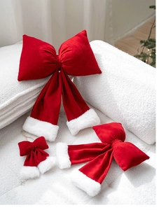 Close-up of red velvet Christmas bows with white faux fur trim in various sizes