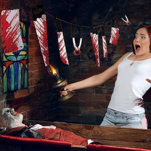 Realistic blood-stained weapon banner detail featuring a bloody cleaver and hand saw decor