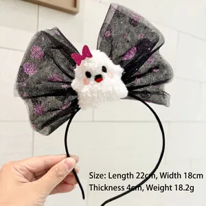 Detail of Halloween headband with black mesh bow and cute plush ghost mascot