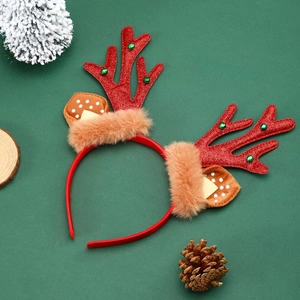Detail of red sequin reindeer antlers headband with festive green bells and plush ears