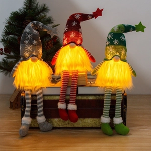Three glowing Christmas Gnomes with long legs and LED lights for festive holiday decor