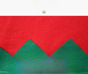 Detailed close-up of premium red and green non-woven Christmas chair cover fabric