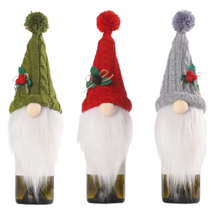 Three-piece Christmas gnome wine bottle covers set in red, green, and grey knit