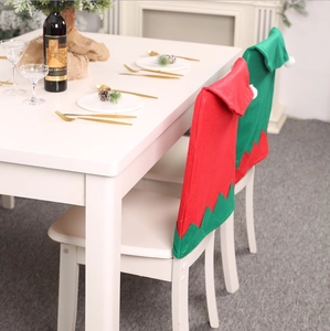 Christmas elf chair covers in red and green felt for festive dining room decor
