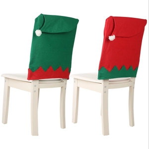 Red and green elf hat chair covers in non-woven fabric for Christmas home decor set
