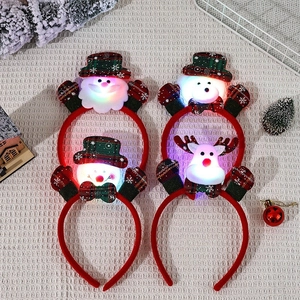 LED light-up Christmas headband featuring Santa and Snowman plush decor with plaid details