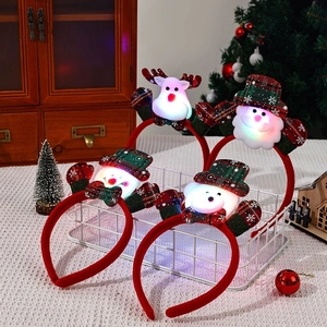 Set of four LED glowing Christmas headbands with Santa, Reindeer, and Snowman designs