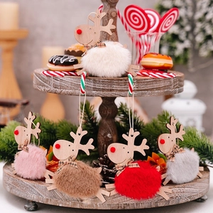 Five assorted wooden Christmas reindeer ornaments with colorful plush bodies and bows