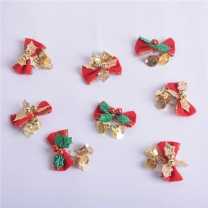 Set of 8 red velvet Christmas bows featuring gold metal bells and green leaves decor
