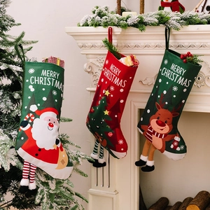 Festive Christmas stockings set with Santa, reindeer and tree hanging on a white fireplace