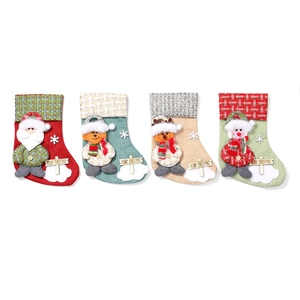 Set of four linen Christmas stockings with 3D Santa reindeer snowman and bear designs