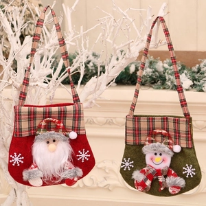 Christmas gift bags with 3D Santa and Snowman designs featuring plaid handles and snowflakes