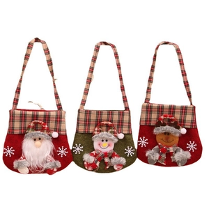 Three Christmas gift bags featuring Santa, Snowman, and Reindeer with plaid handles