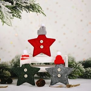 Three felt star Christmas ornaments in red, green, and grey with mini knitted hats