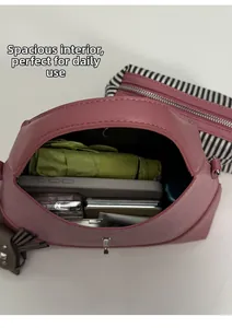 Top macro view of large capacity pink hobo bag interior showing daily storage space