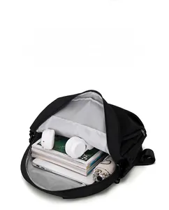 Macro view of large black travel backpack interior showing storage for tablet and umbrella