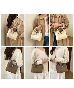 Detail of lychee textured leather bucket bag with silver buckle and detachable strap