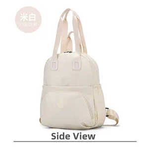 Detail view of cream white large capacity nylon backpack with side pockets and zippers