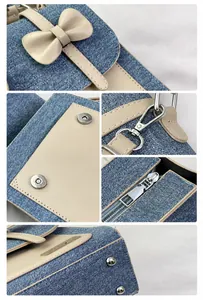 Detailed view of blue denim and beige leather stitching with bow flap and metal hardware