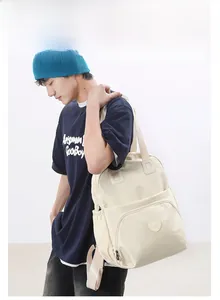 Side view of high-capacity cream white backpack with minimalist nylon design and zippers