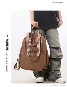 Detail view of high quality soft top layer cowhide material on dark brown backpack