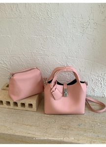 Pink lychee grain leather bucket bag set with silver hardware and inner pouch