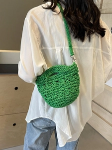 Handmade green crochet crossbody bag with hollow wavy pattern for beach vacation
