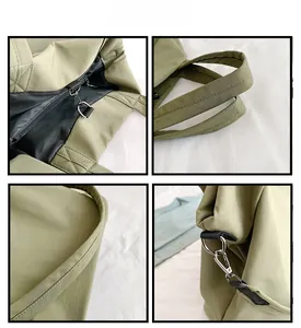 Détails macro du cabas en nylon montrant les poignées renforcées et les fermetures éclair
