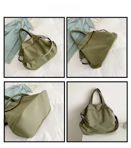 Vue détaillée du fourre-tout en nylon vert militaire montrant les angles et la bandoulière