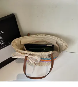 Top view of woven beach tote showing spacious interior with zipper pocket and lining