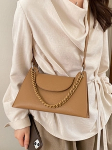 Brown lychee texture trapezoid crossbody bag with thick chain and slim strap
