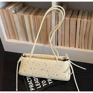 Minimalist cream shoulder bag with silver star prints and side bow knot detail