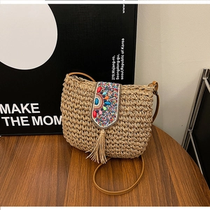 Bohemian straw woven crossbody bag with colorful bead embroidery and fringe tassels