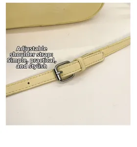 Detailed close-up showing adjustable yellow leather strap with silver metal buckle