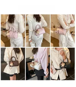 Boston barrel bag in pink brown white and black with cute plush bear charms