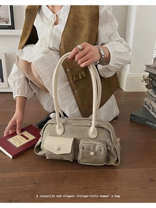 Detail view of the elegant vintage canvas bag with contrasting leather handles and pockets