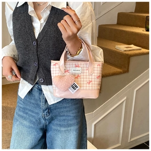 Pink checkered mini tote bag featuring red bow embroidery and heart plush charm
