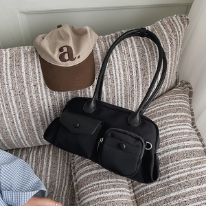 Minimalist black multi-pocket shoulder bag with stylish contrast design and large capacity