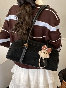 Vintage black matte baguette shoulder bag with cute plush bear charm and ribbon