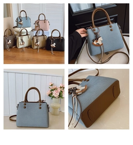 Dettaglio delle cuciture a contrasto e dei piedini protettivi sulla borsa a mano vintage